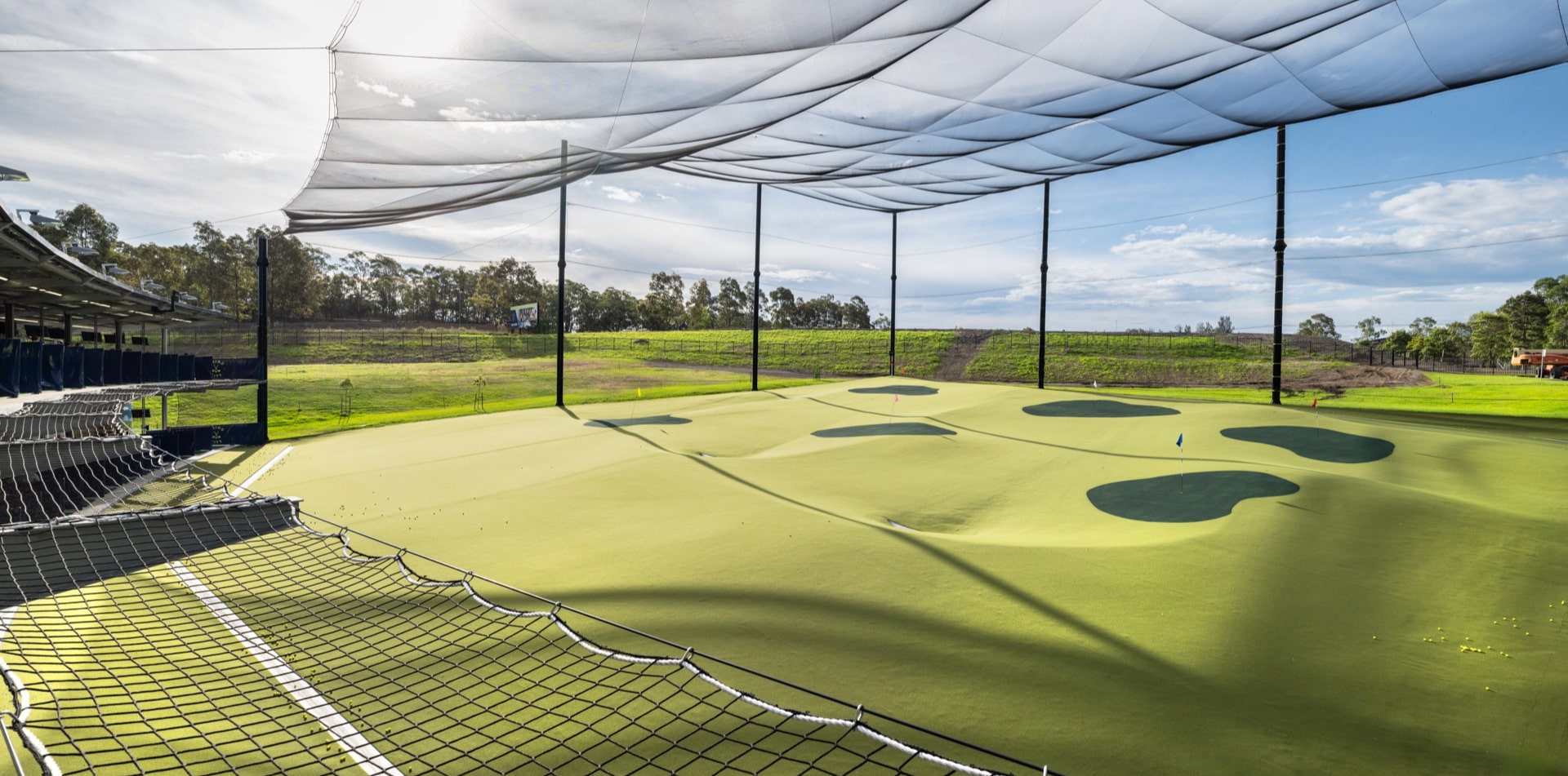 SwingCity golf facility with barrier netting